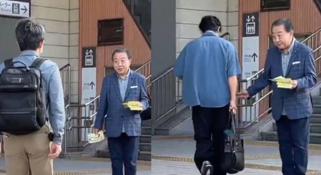 Japonya'nın eski başbakanı Noda, istasyon önünde broşür dağıtırken görüntülendi